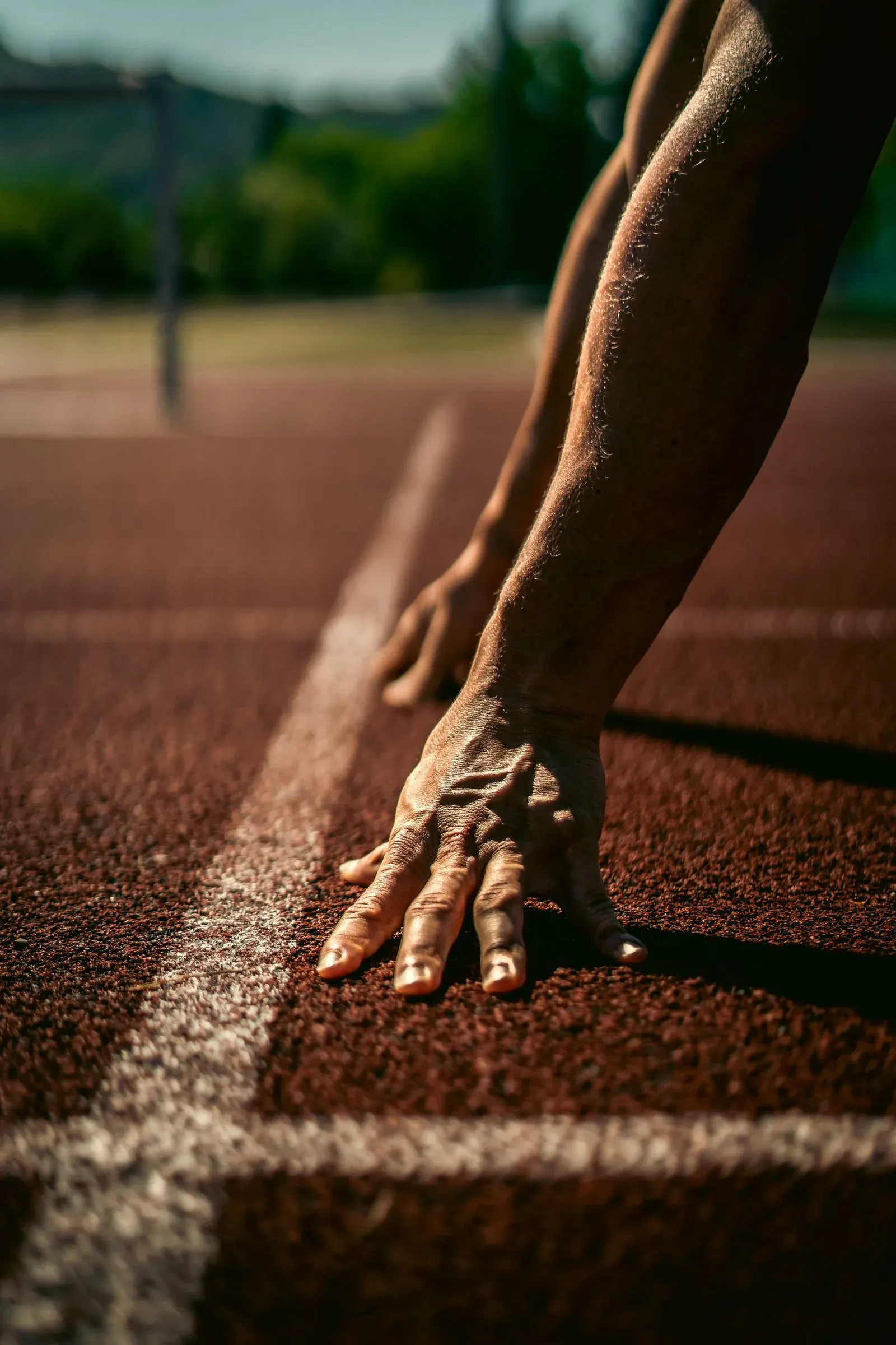 A hand set down on the starting line, another beginning that still counts.