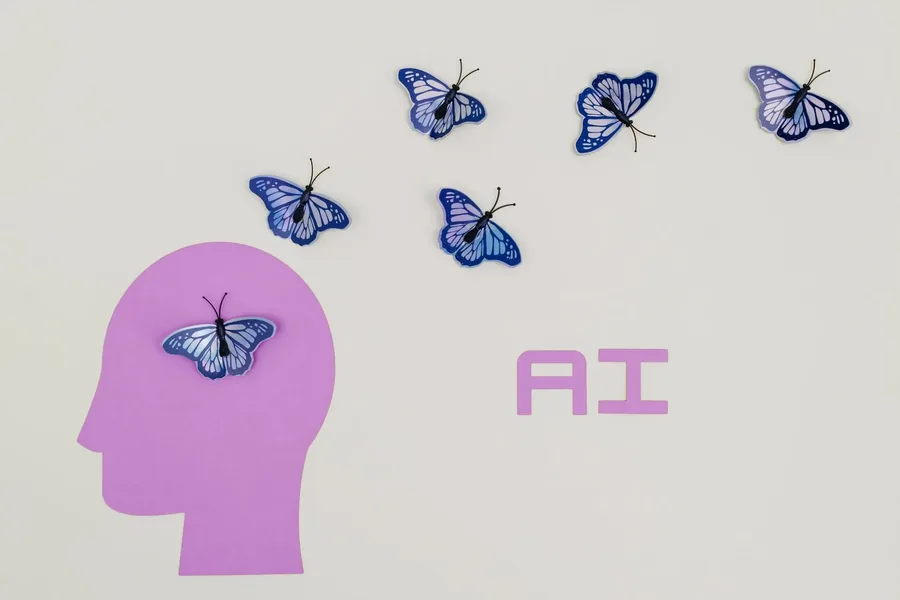 Butterflies lifting from a paper cut-out head, ideas with something helping them out.