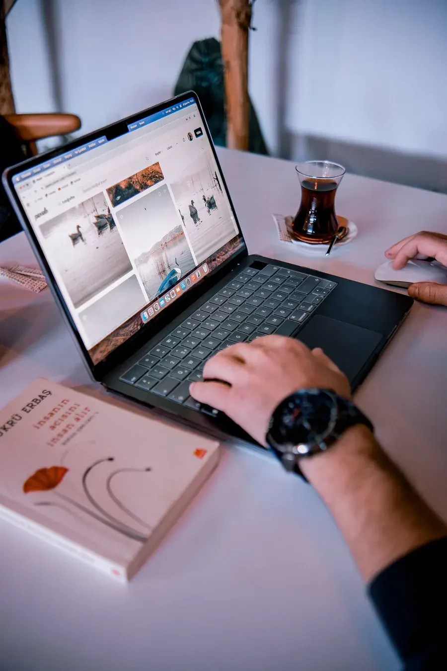 Work spread across a laptop screen, everything a mind was never meant to hold.
