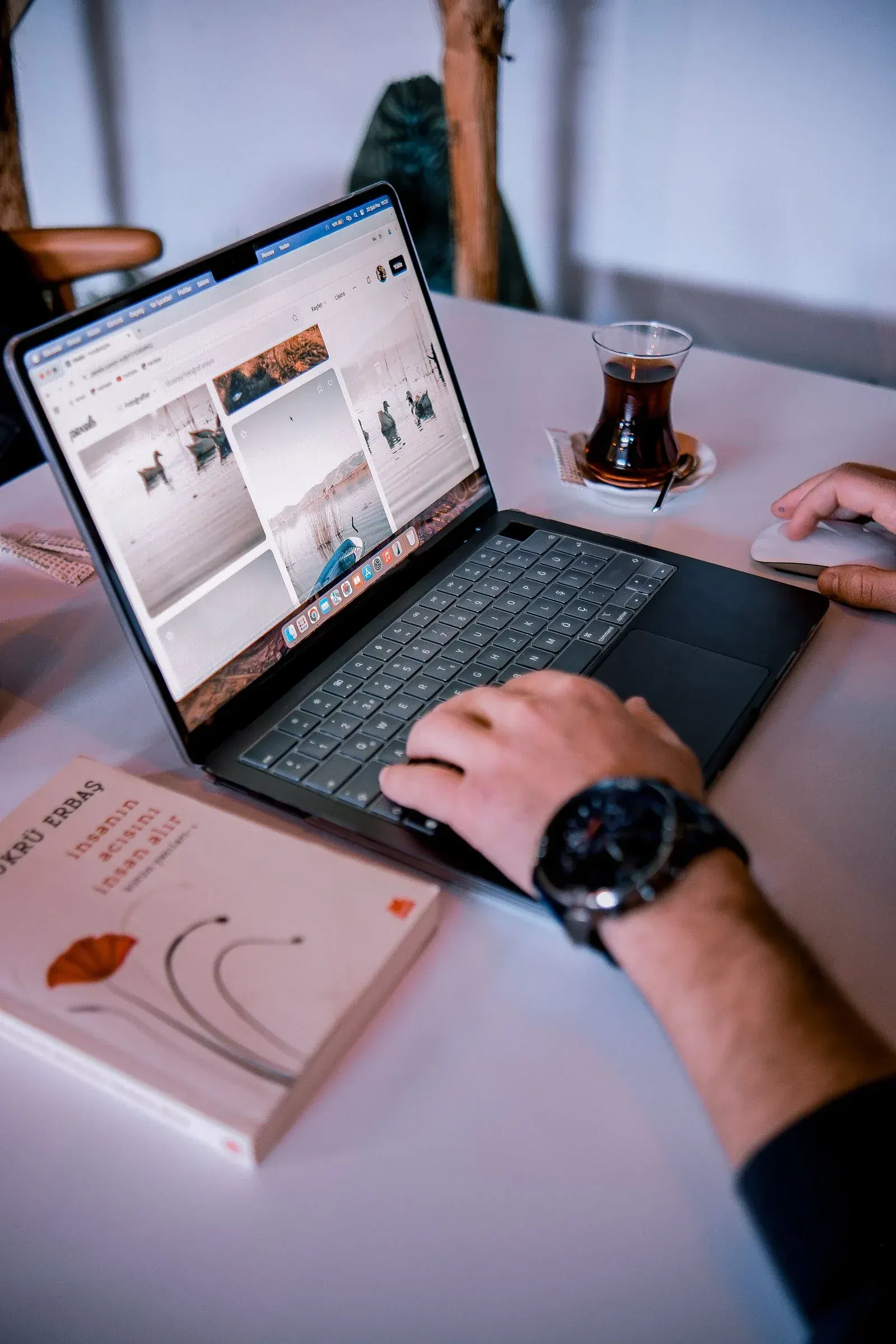 Work spread across a laptop screen, everything a mind was never meant to hold.