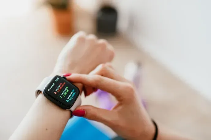 A finger tapping a watch for a verdict on effort the body already knew.