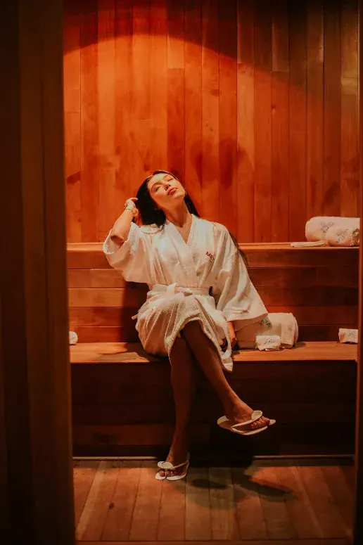 A woman in the heat of a wooden sauna, thoughts arriving in shorter sentences.
